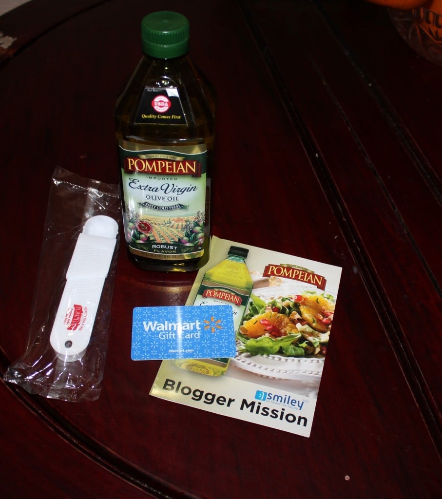 Pompeian Extra Virgin Olive Oil on table with paper and measureing spoon